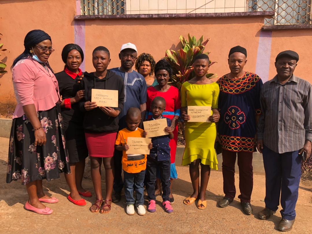 Be Merciful Foundation team with families supported by the foundation